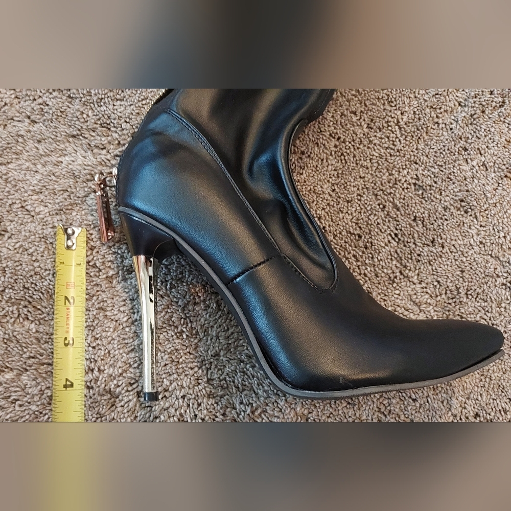 Sleek Black and Gold Heeled Boots